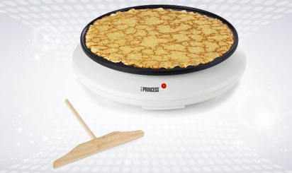 White crepe maker with wooden spatula
