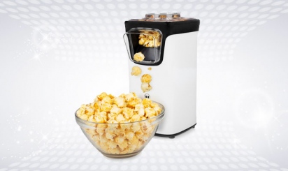 White popcorn machine with bowl full of popcorn