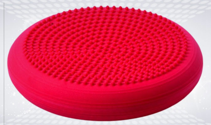 Red balance cushion with raised dimples